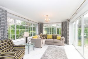 The Blossoms, bright and airy sunroom leading out to seating area