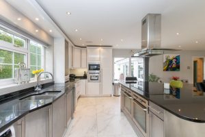 Modern kitchen with white gloss units